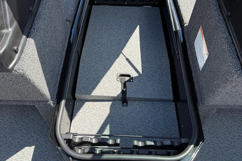 Slide: The Image of Interior view of 2026 Lund 1875 Impact XS Sport boat storage compartment. - 22