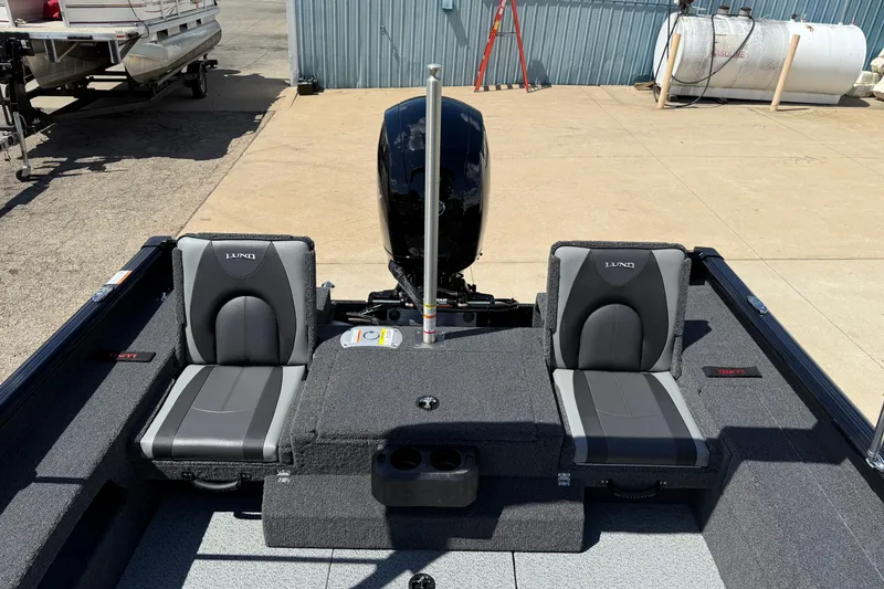 Slide: The Image of 2026 Lund 1875 Impact XS Sport boat interior with two seats and motor. - 23
