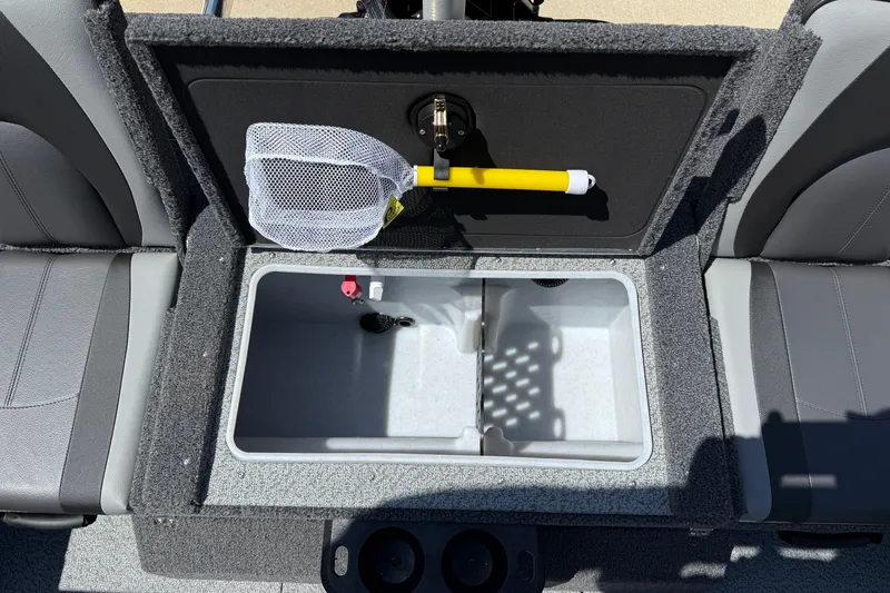 Slide: The Image of 2026 Lund 1875 Impact XS Sport boat interior with storage compartment and fishing net. - 27