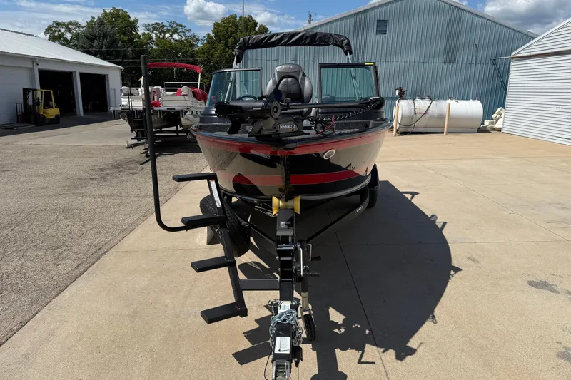 Slide: The Image of 2026 Lund 1875 Impact XS Sport boat on trailer in outdoor storage area. - 3