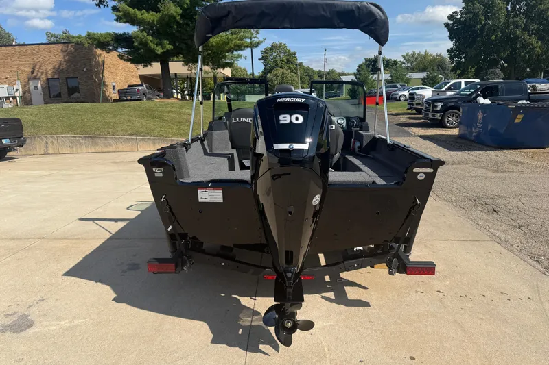 Slide: The Image of 2026 Lund 1650 Rebel XL Sport boat with Mercury engine on trailer. - 5