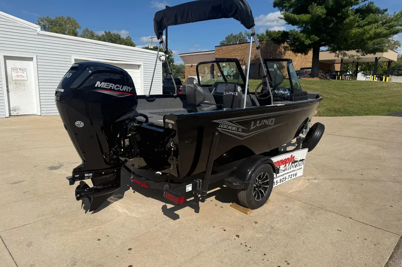 Slide: The Image of 2026 Lund 1650 Rebel XL Sport boat with front seating and windshield. - 6