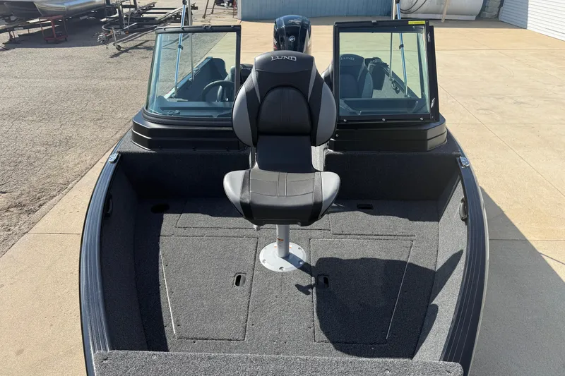 Slide: The Image of 2026 Lund 1650 Rebel XL Sport boat interior with branded seat and carpeted deck. - 7