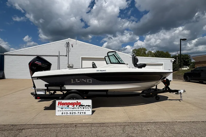 The Image of 2026 Lund 185 Impact GL boat on trailer at Hennepin Marine dealership. - 0