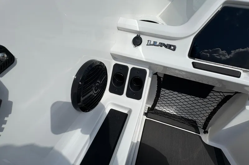 Slide: The Image of 2026 Lund 185 Impact GL boat interior with speaker and storage net. - 21