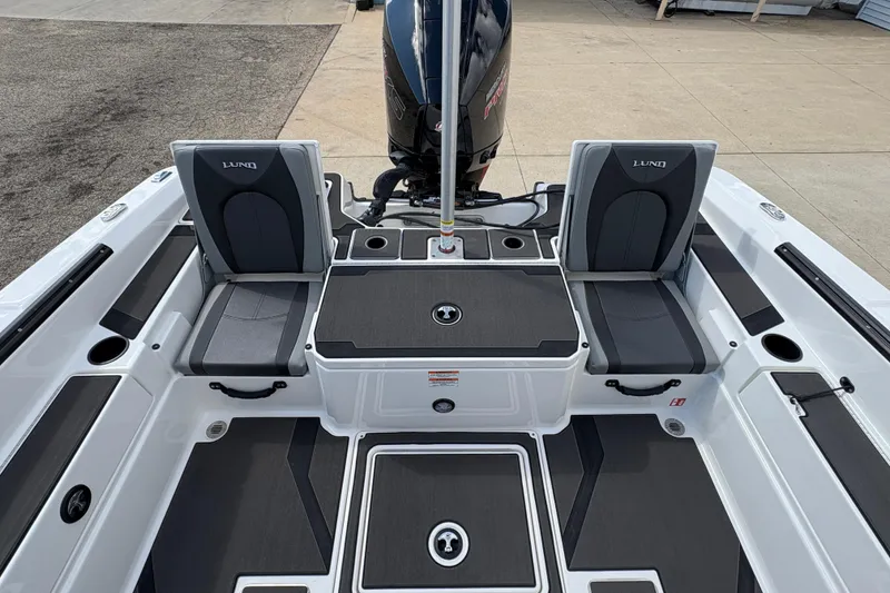 Slide: The Image of 2026 Lund 185 Impact GL boat interior with seating and storage compartments. - 26