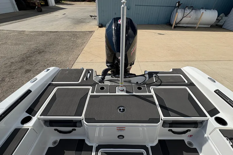 Slide: The Image of 2026 Lund 185 Impact GL boat with sleek deck and powerful outboard motor. - 29