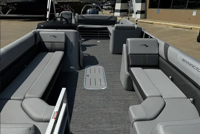 Slide: The Image of 2025 Bennington 25 SXSB pontoon boat interior with gray seating and flooring. - 11