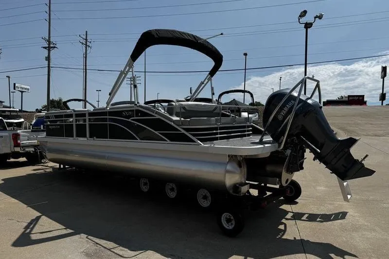 Slide: The Image of 2025 Bennington 25 SXSB pontoon boat with Yamaha outboard motor on trailer. - 6