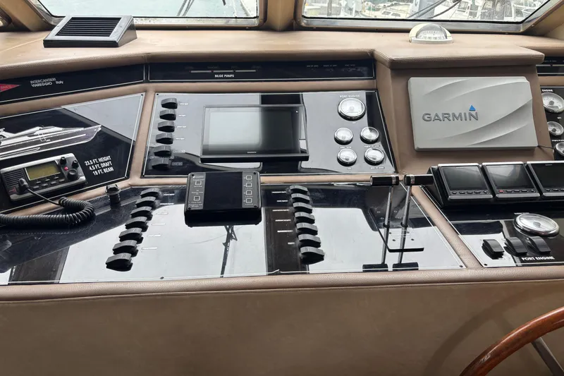 Slide: The Image of Cockpit of 1986 Maiora Phantom yacht with Garmin navigation system and control panels. - 11