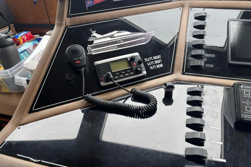 Slide: The Image of Control panel of a 1986 Maiora Phantom yacht with communication equipment and switches. - 13