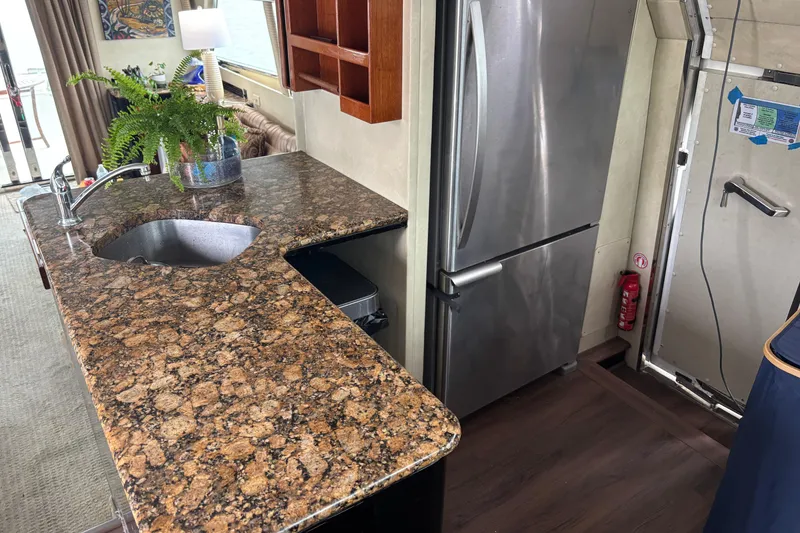 Slide: The Image of Luxurious 1986 Maiora Phantom yacht interior with elegant decor and ocean view. - 16