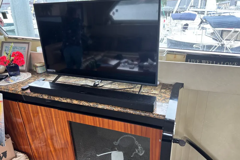 Slide: The Image of Interior of 1986 Maiora Phantom yacht with TV and decorative items. - 18