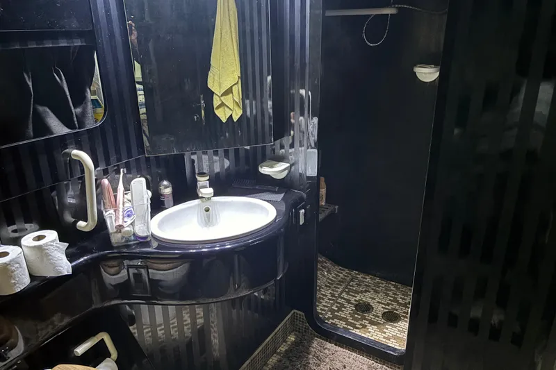 Slide: The Image of Luxurious 1986 Maiora Phantom bathroom with sleek black design and modern amenities. - 28