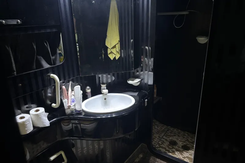 Slide: The Image of Luxurious 1986 Maiora Phantom bathroom with sleek black design and modern amenities. - 29