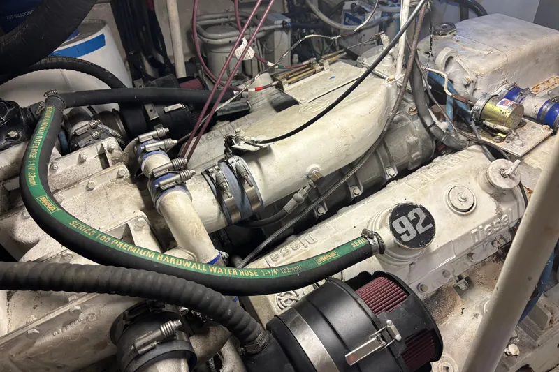 Slide: The Image of Engine compartment of a 1986 Maiora Phantom with visible hoses and components. - 34
