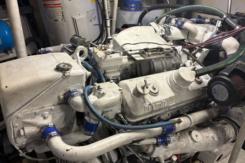 Slide: The Image of Engine of a 1986 Maiora Phantom yacht, featuring complex piping and components. - 36
