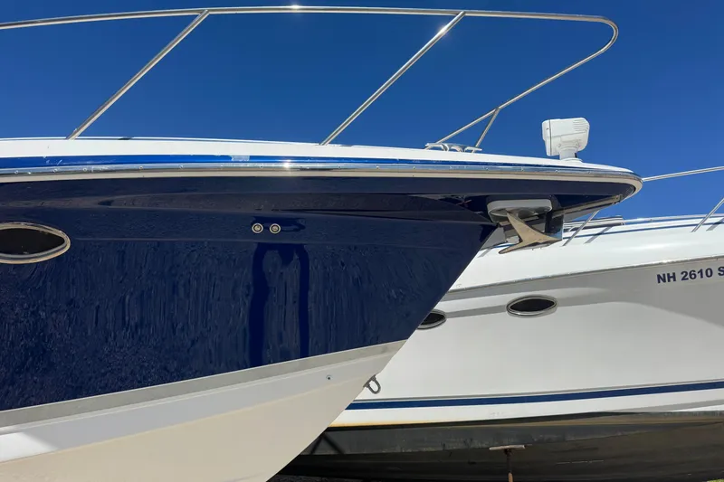 Slide: The Image of 2006 Formula 40 Performance Cruiser boat with sleek blue hull and stainless steel railings. - 2