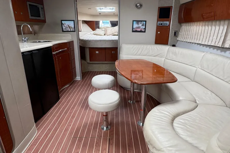 Slide: The Image of Interior of a 2006 Formula 40 Performance Cruiser with modern kitchen and cozy seating area. - 23