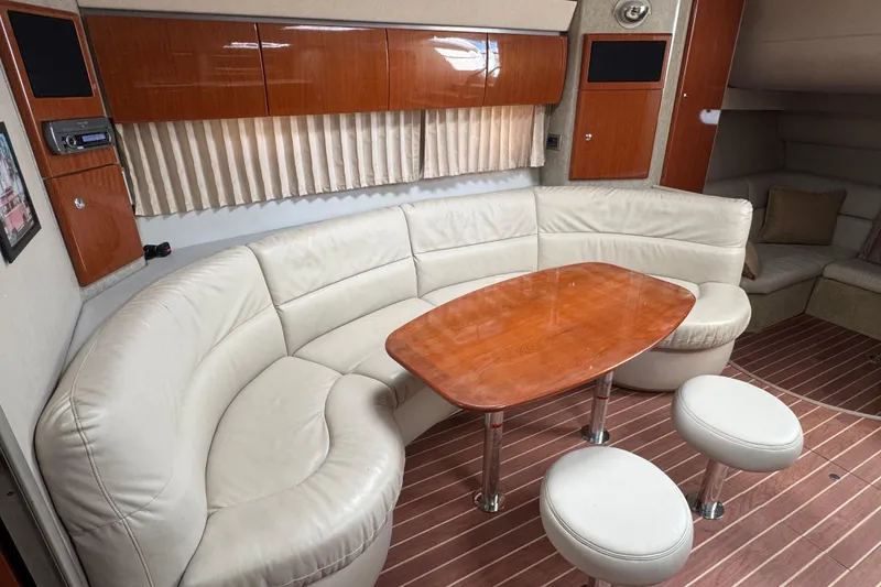 Slide: The Image of Interior of 2006 Formula 40 Performance Cruiser with leather seating and wooden table. - 24