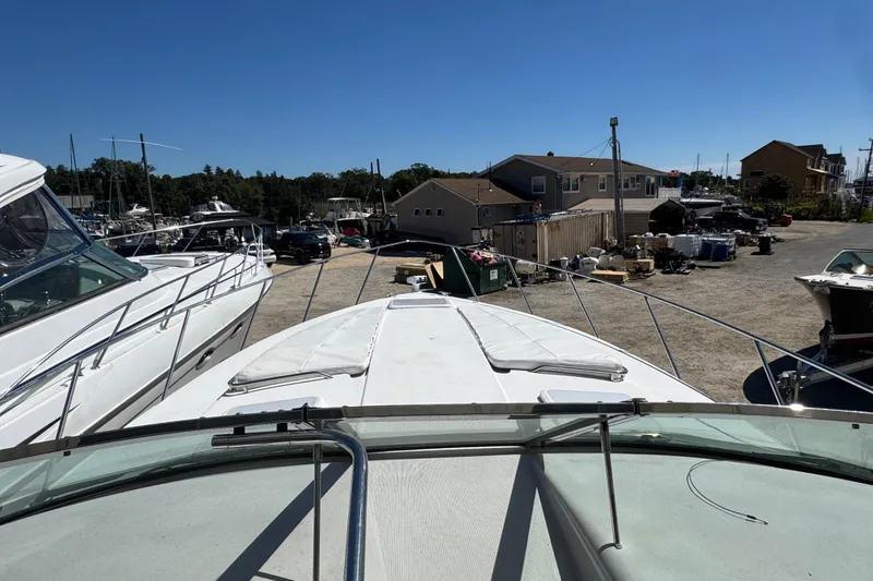 Slide: The Image of 2006 Formula 40 Performance Cruiser docked at a marina, surrounded by other boats. - 26