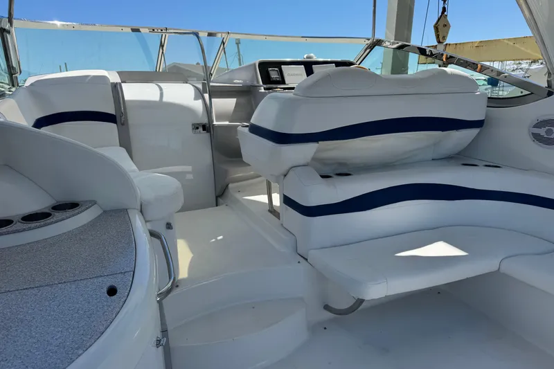 Slide: The Image of Interior of a 2006 Formula 40 Performance Cruiser with white seating and blue accents. - 35