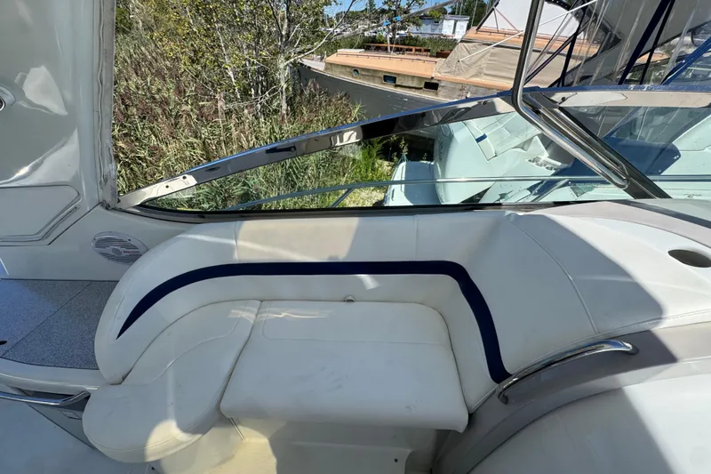 Slide: The Image of Interior of 2006 Formula 40 Performance Cruiser with white seating and blue accents. - 36