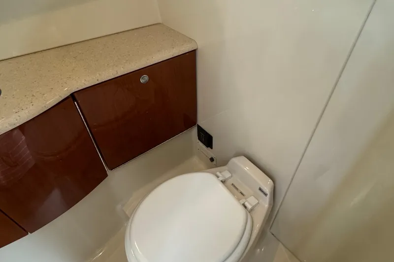 Slide: The Image of 2006 Formula 40 Performance Cruiser bathroom with modern fixtures and wooden cabinetry. - 44