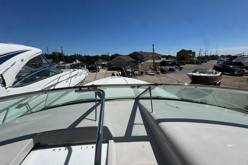 Slide: The Image of 2006 Formula 40 Performance Cruiser docked, showcasing sleek design and marina surroundings. - 46