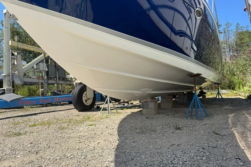 Slide: The Image of 2006 Formula 40 Performance Cruiser on stands, hull view, outdoor setting. - 8