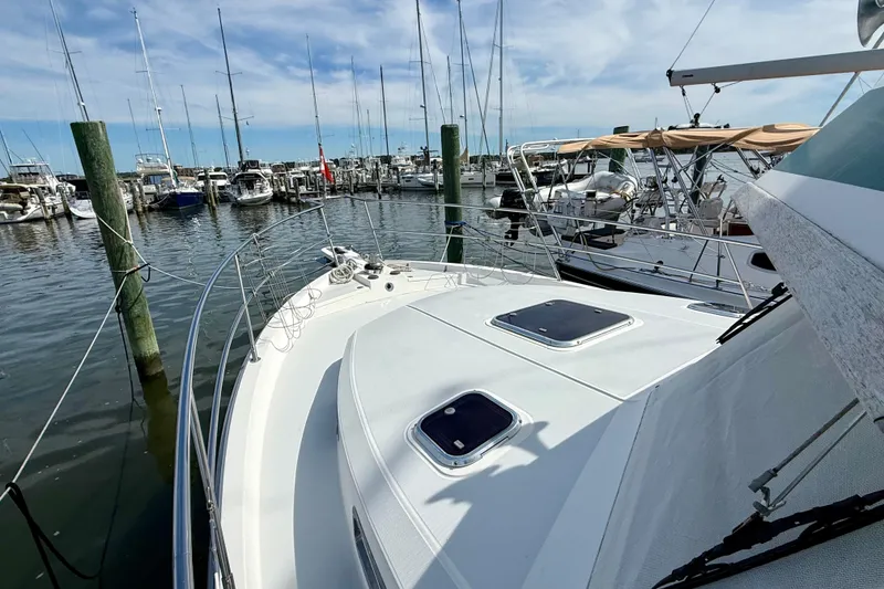 Slide: The Image of 2001 Sabre Sabreline 34 yacht docked at marina, surrounded by sailboats. - 11