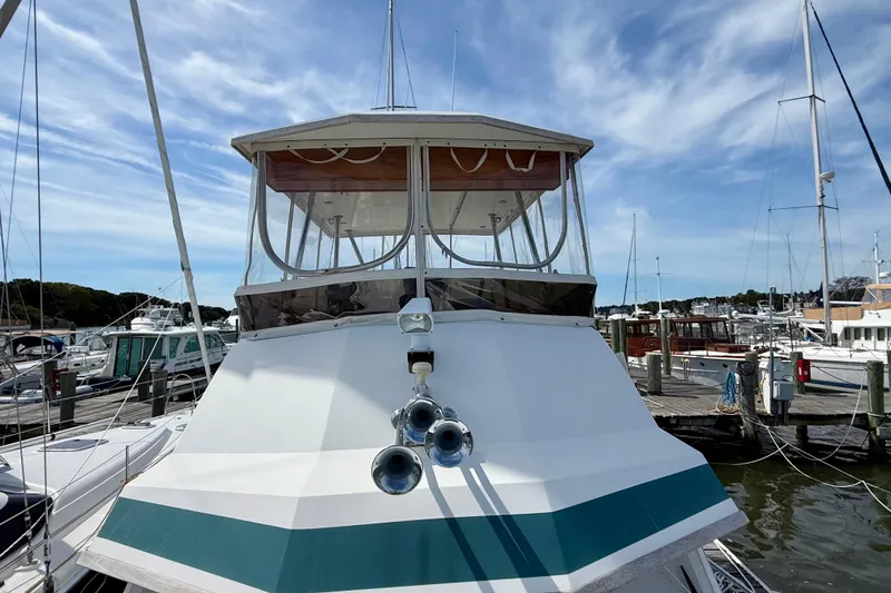 Slide: The Image of 2001 Sabre Sabreline 34 yacht docked at marina under blue sky. - 14