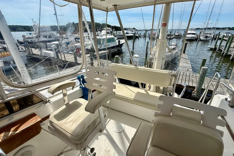 Slide: The Image of 2001 Sabre Sabreline 34 yacht interior with marina view, featuring comfortable seating. - 23