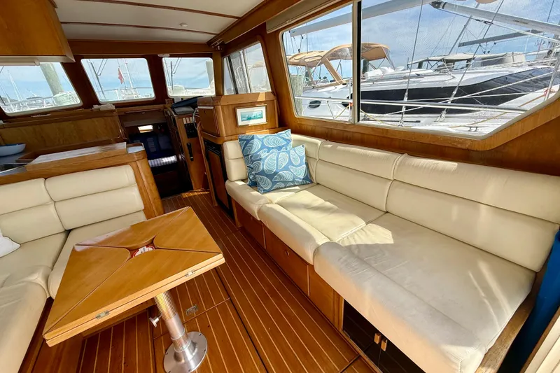 Slide: The Image of Interior of 2001 Sabre Sabreline 34 yacht with elegant wood and cream seating. - 28