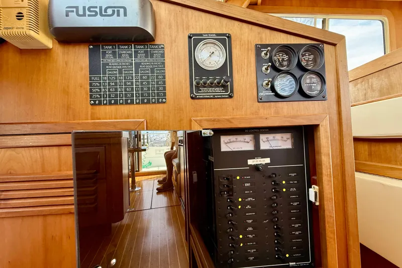 Slide: The Image of Control panel of a 2001 Sabre Sabreline 34 boat, featuring gauges and switches. - 37