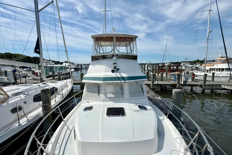 Slide: The Image of 2001 Sabre Sabreline 34 yacht docked at a marina under a clear sky. - 7