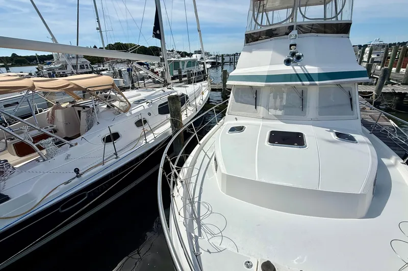 Slide: The Image of 2001 Sabre Sabreline 34 yacht docked alongside other boats in a marina. - 8