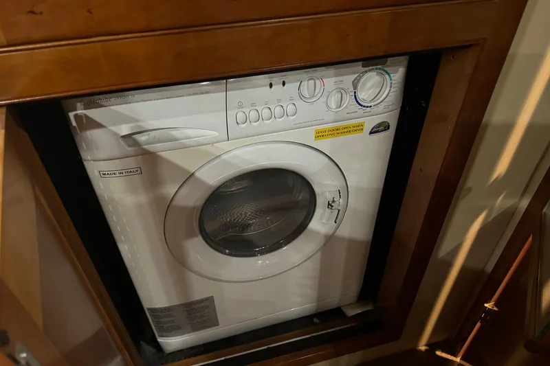 Slide: The Image of Built-in washing machine on 2006 Cruisers Yachts 560 Express, made in Italy. - 11