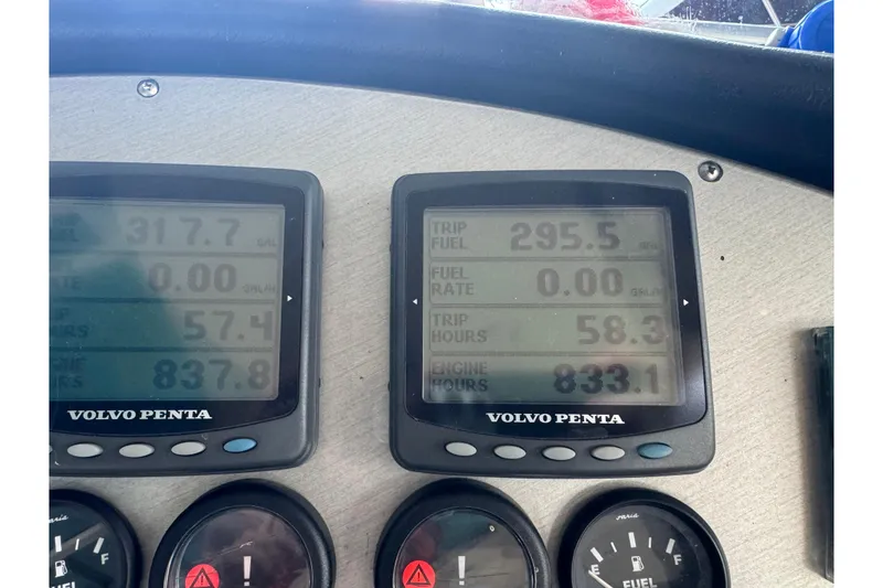 Slide: The Image of Dashboard of a 2006 Cruisers Yachts 560 Express showing engine and trip data. - 19