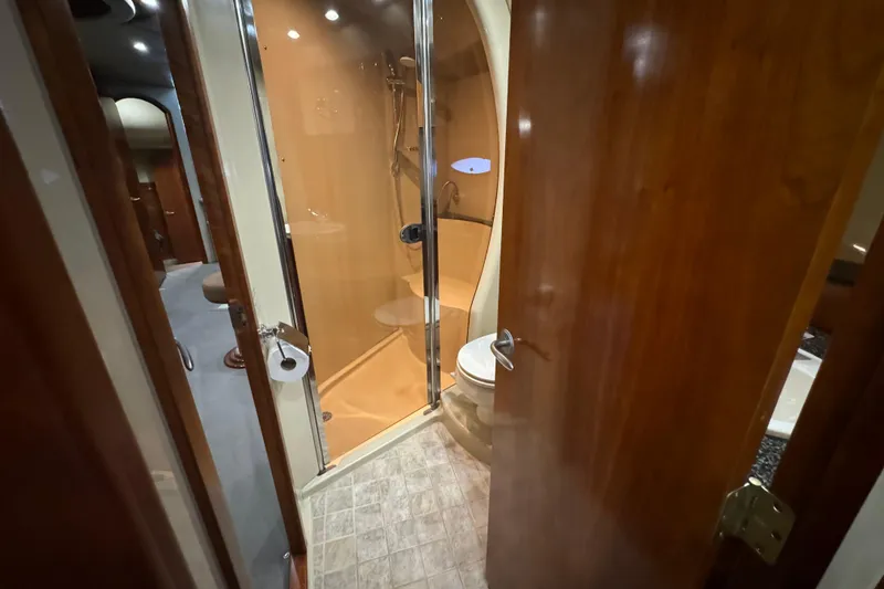 Slide: The Image of Bathroom interior of 2006 Cruisers Yachts 560 Express with shower and toilet. - 21