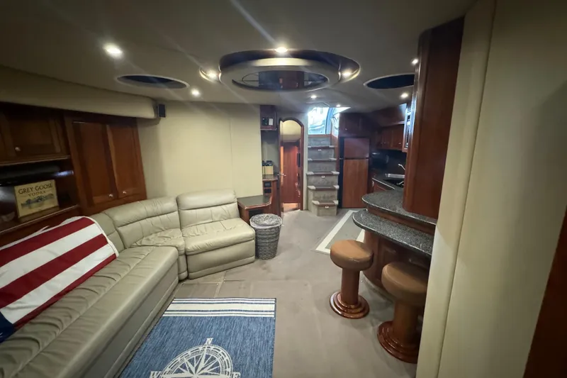 Slide: The Image of Luxurious interior of 2006 Cruisers Yachts 560 Express with plush seating and elegant design. - 22