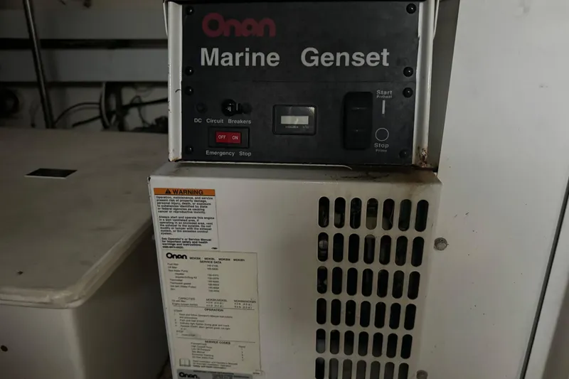 Slide: The Image of Onan Marine Genset in 2006 Cruisers Yachts 560 Express engine room. - 24