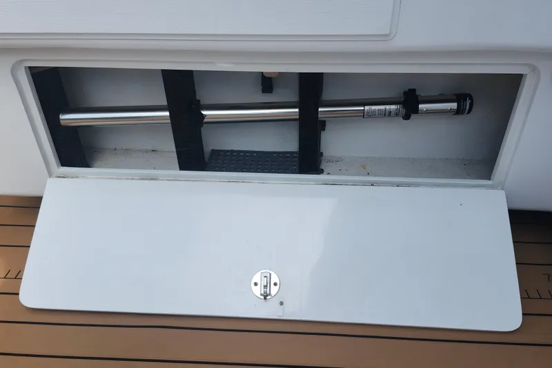 Slide: The Image of Storage compartment on 2003 Shearline 30 Express boat with stainless steel rod. - 40