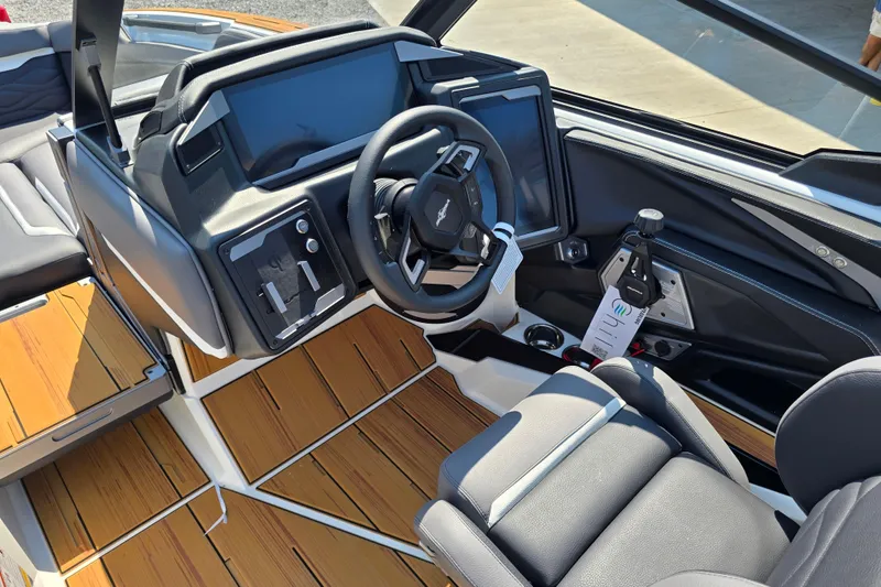 Slide: The Image of 2026 Supra SA boat interior with modern dashboard and steering wheel design. - 10