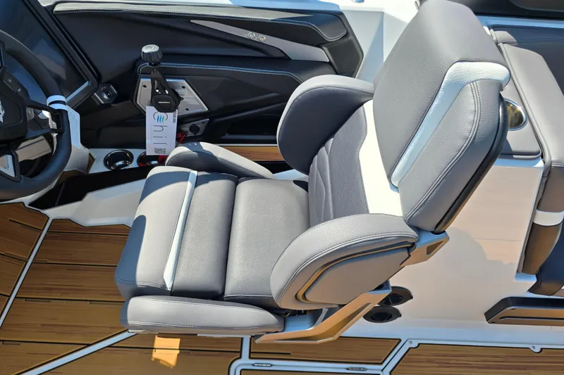 Slide: The Image of 2026 Supra SA boat interior with luxurious gray seating and modern steering controls. - 11