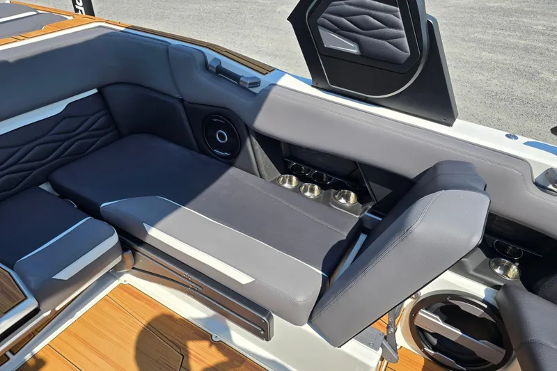 Slide: The Image of Luxurious interior of 2026 Supra SA boat with sleek seating and cup holders. - 13