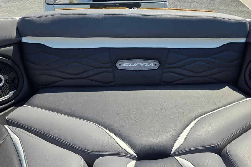 Slide: The Image of 2026 Supra SA boat interior with premium leather seating and speaker system. - 17