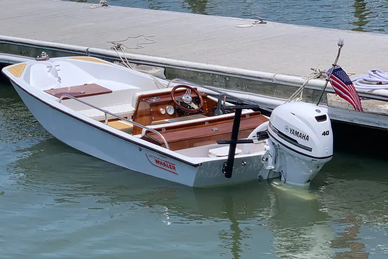 The Image of 1981 Boston Whaler 13 Super Sport boat with Yamaha 40 engine docked in marina. - 0