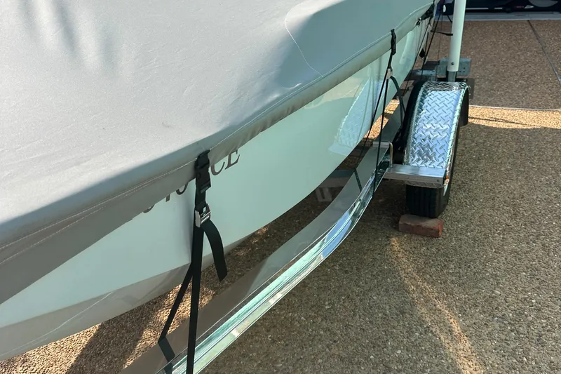 Slide: The Image of 1981 Boston Whaler 13 Super Sport boat on trailer, covered and secured. - 17