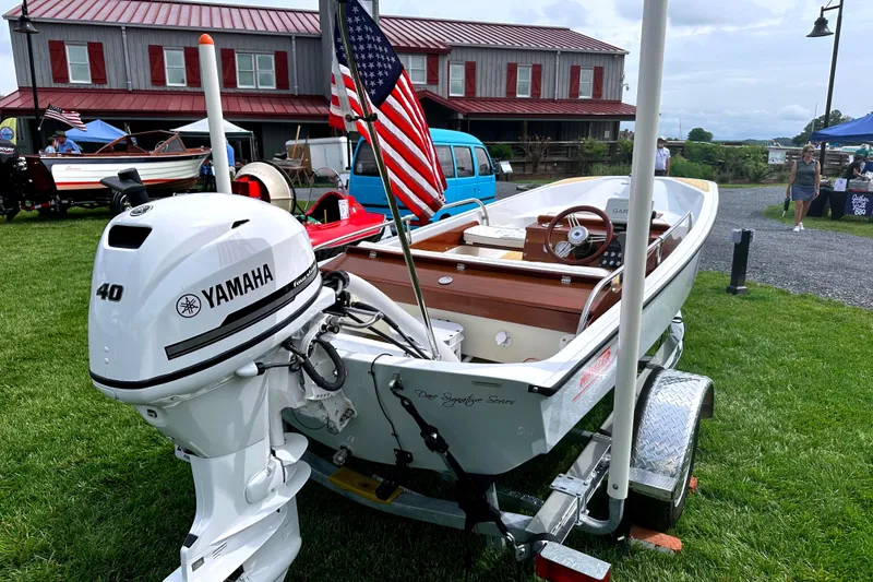 Slide: The Image of 1981 Boston Whaler 13 Super Sport with Yamaha engine on display outdoors. - 5